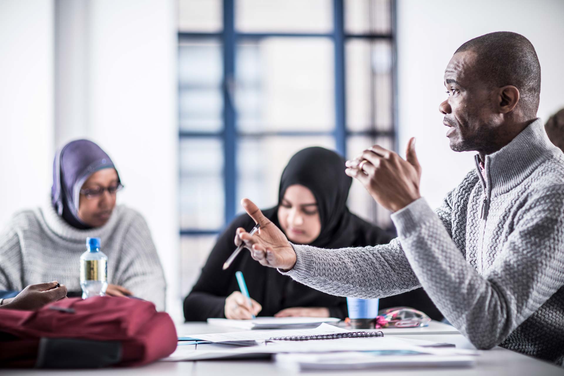 Student discussion around a table