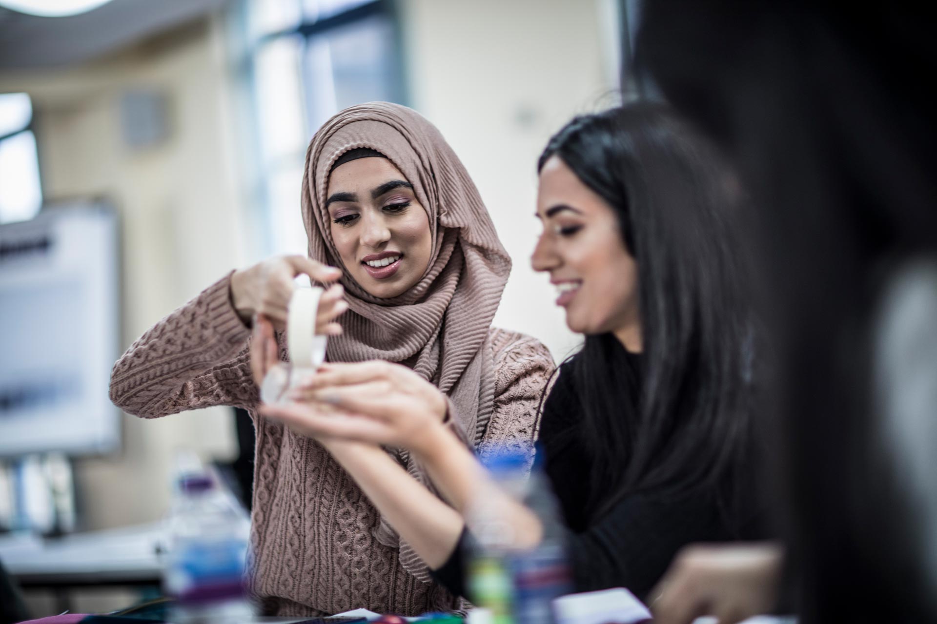 Two students from the School of education working on a project