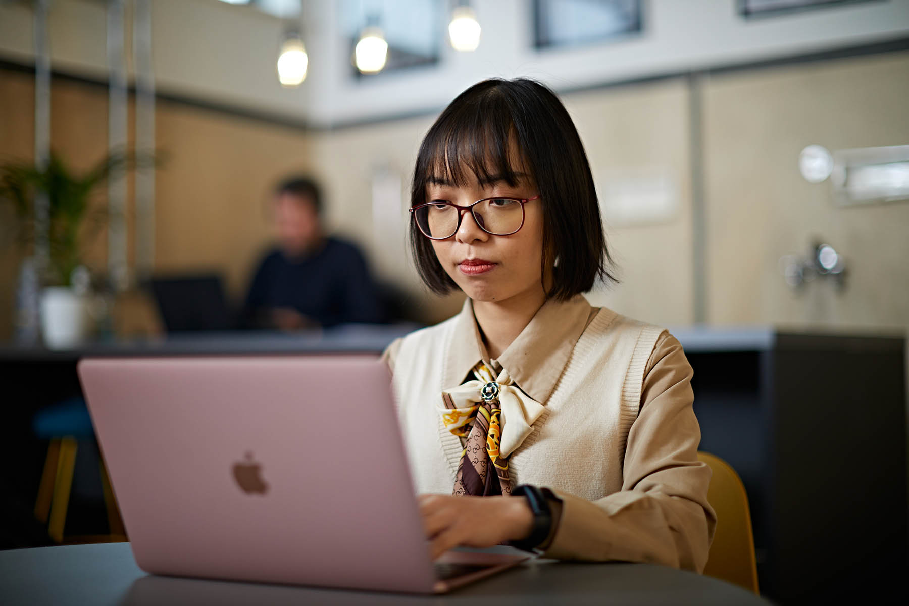 A student completing work on their laptop