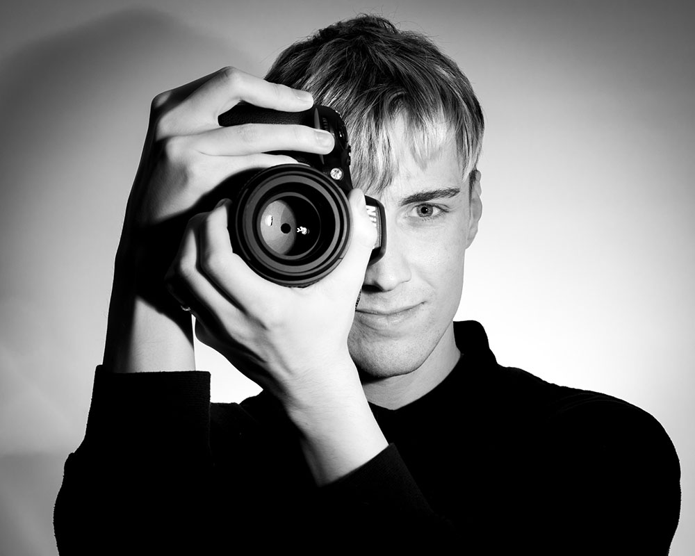 An image of Connor Robinson with his camera